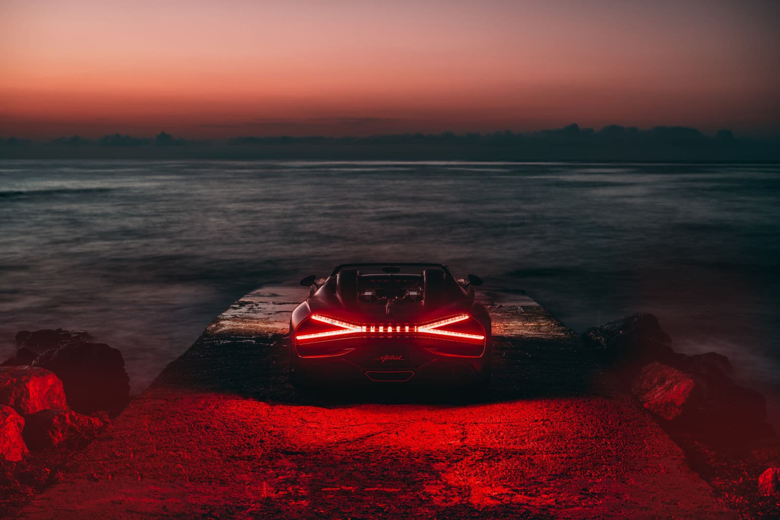 The W16 Mistral’s ’X’-shaped taillights echo the colors of the winter sky.