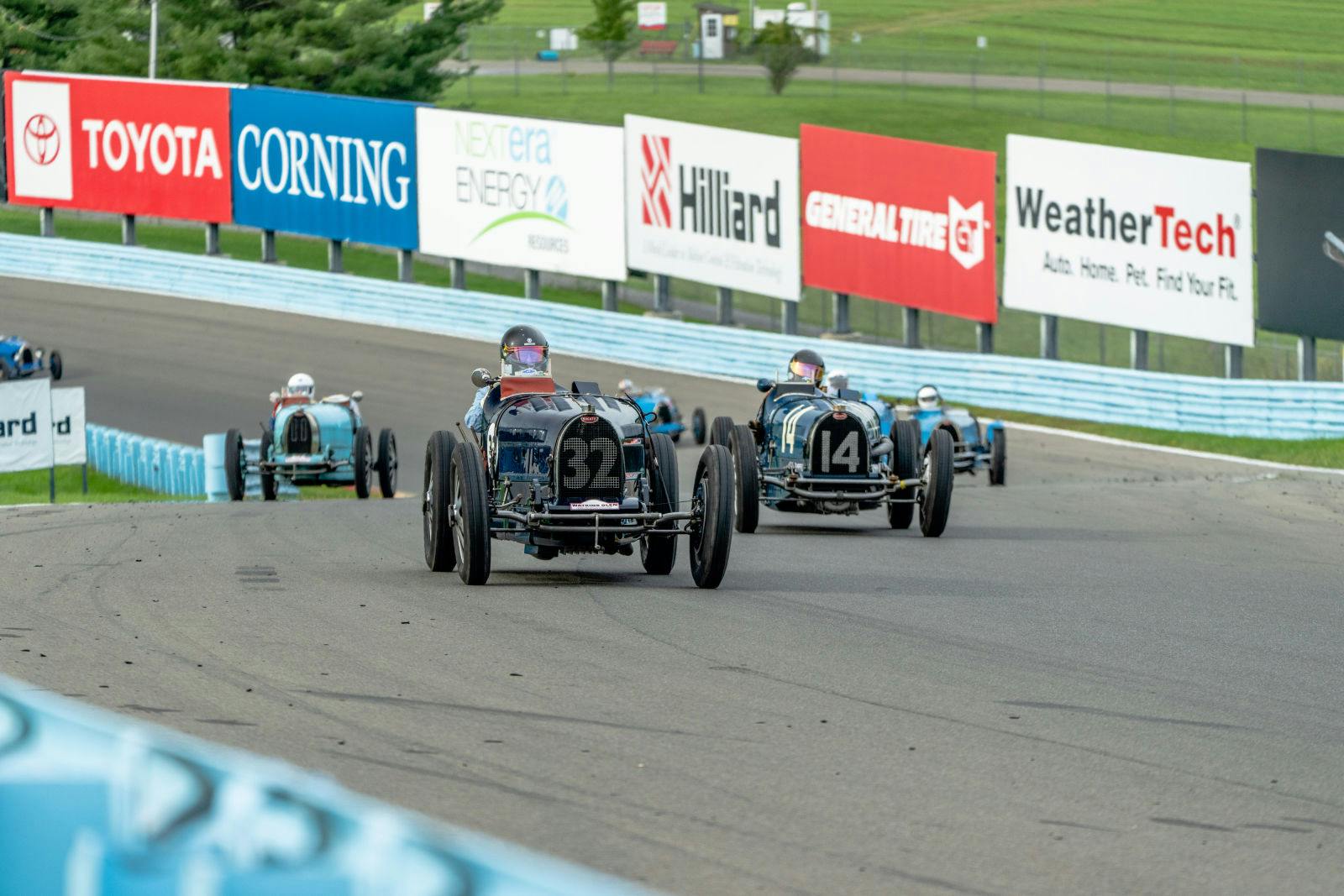 The historic Bugatti models delivered a sensational spectacle as they charged nose-to-tail around the modern Watkins Glen racing circuit.