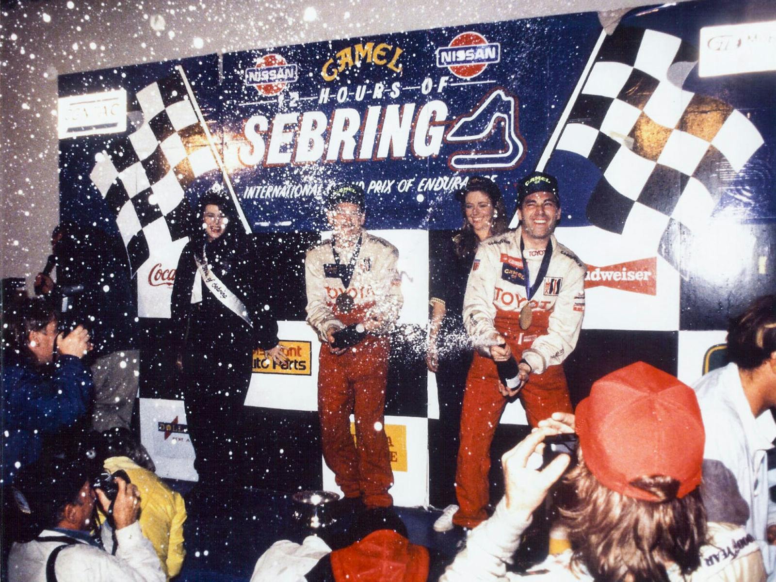 Andy Wallace and Juan Manuel Fangio II celebrating their victory at Sebring in 1992.