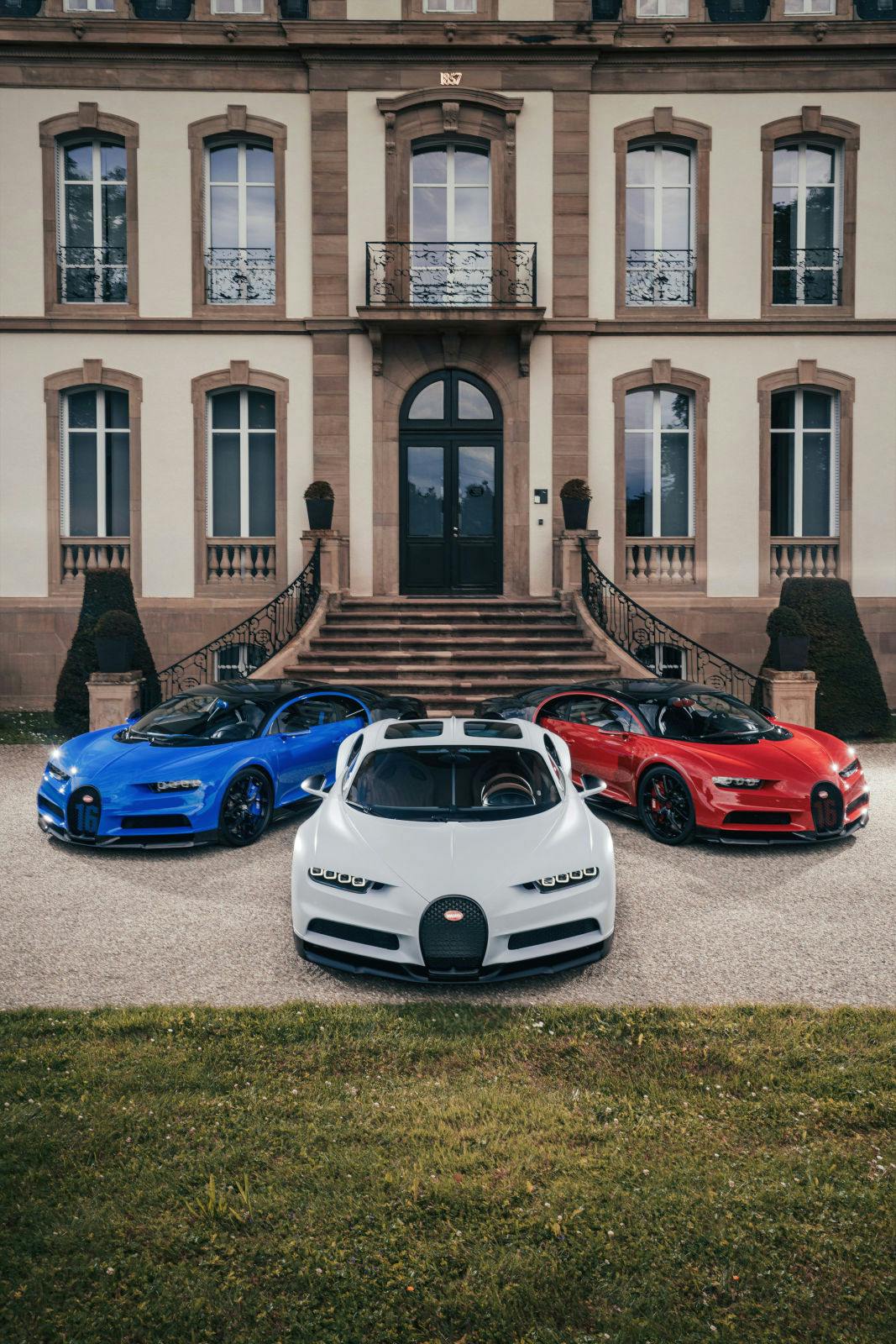 Bugatti celebrates France’s national day : three Chiron Sport in front of the Château Saint-Jean in Molsheim.