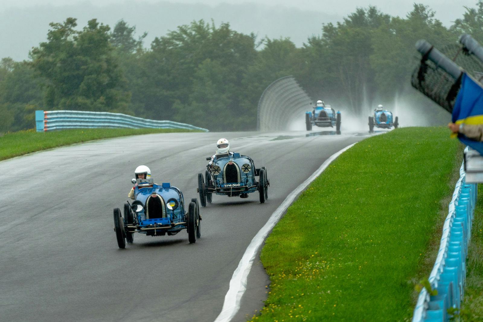The historic Bugatti models delivered a sensational spectacle as they charged nose-to-tail around the modern Watkins Glen racing circuit.