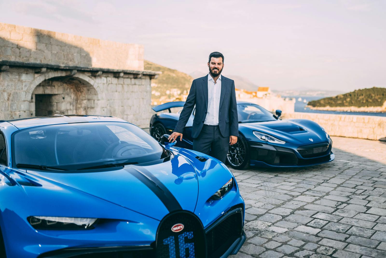 Mate Rimac next to a Bugatti Chiron Pur Sport, founder of Rimac Automobili, is now CEO of the new joint company Bugatti-Rimac.