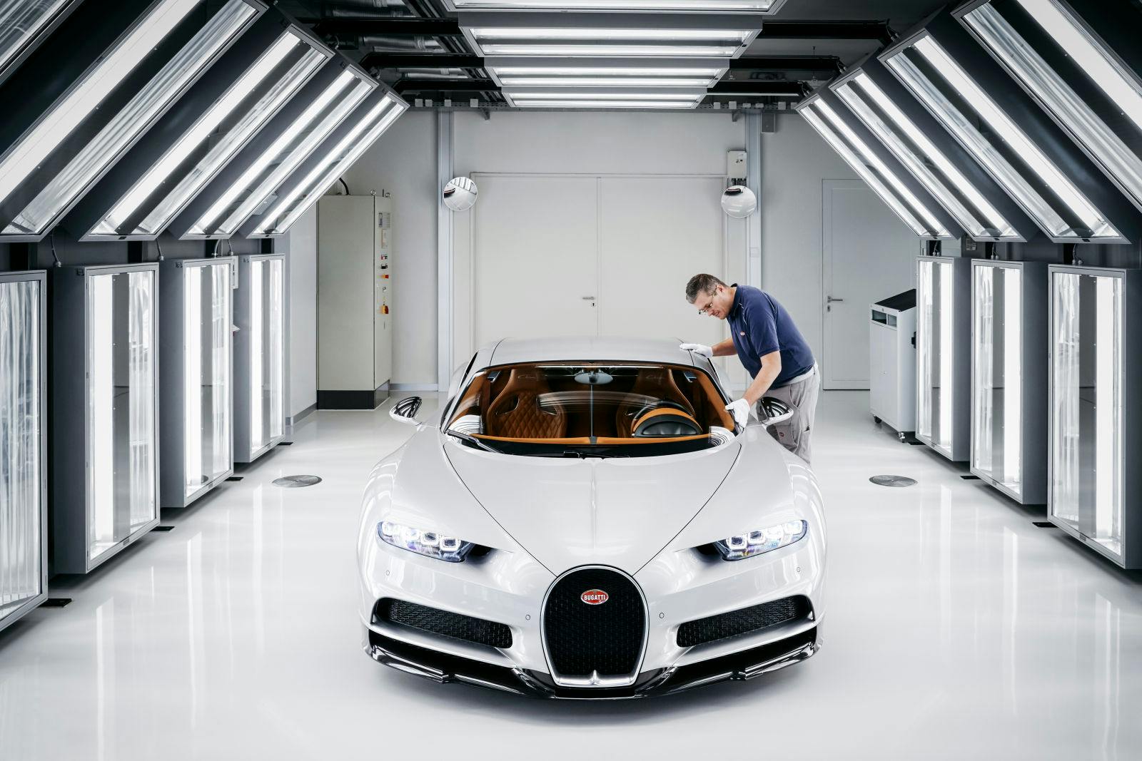 The final paintwork is scrutinized under the bright white lights of Bugatti’s light tunnel for hours in order to identify any near-microscopic blemishes.