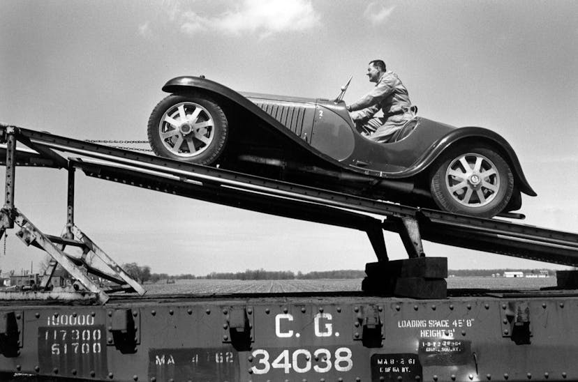 A 1932 Type 55 being loaded onto the railcar.