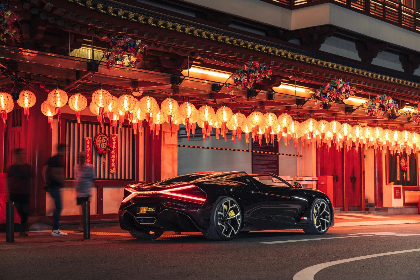 At the Buddha Tooth Relic Temple, onlookers stop to admire the Bugatti W16 Mistral.