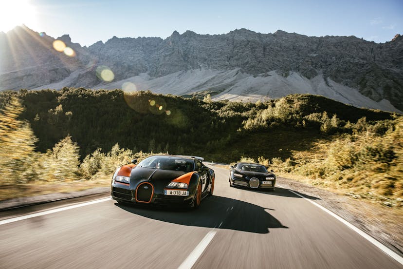 From Italy, via Austria and Germany back home: the Veyron 16.4 Grand Sport Vitesse and the Chiron Sport in front of the impressive landscapes of Austria.